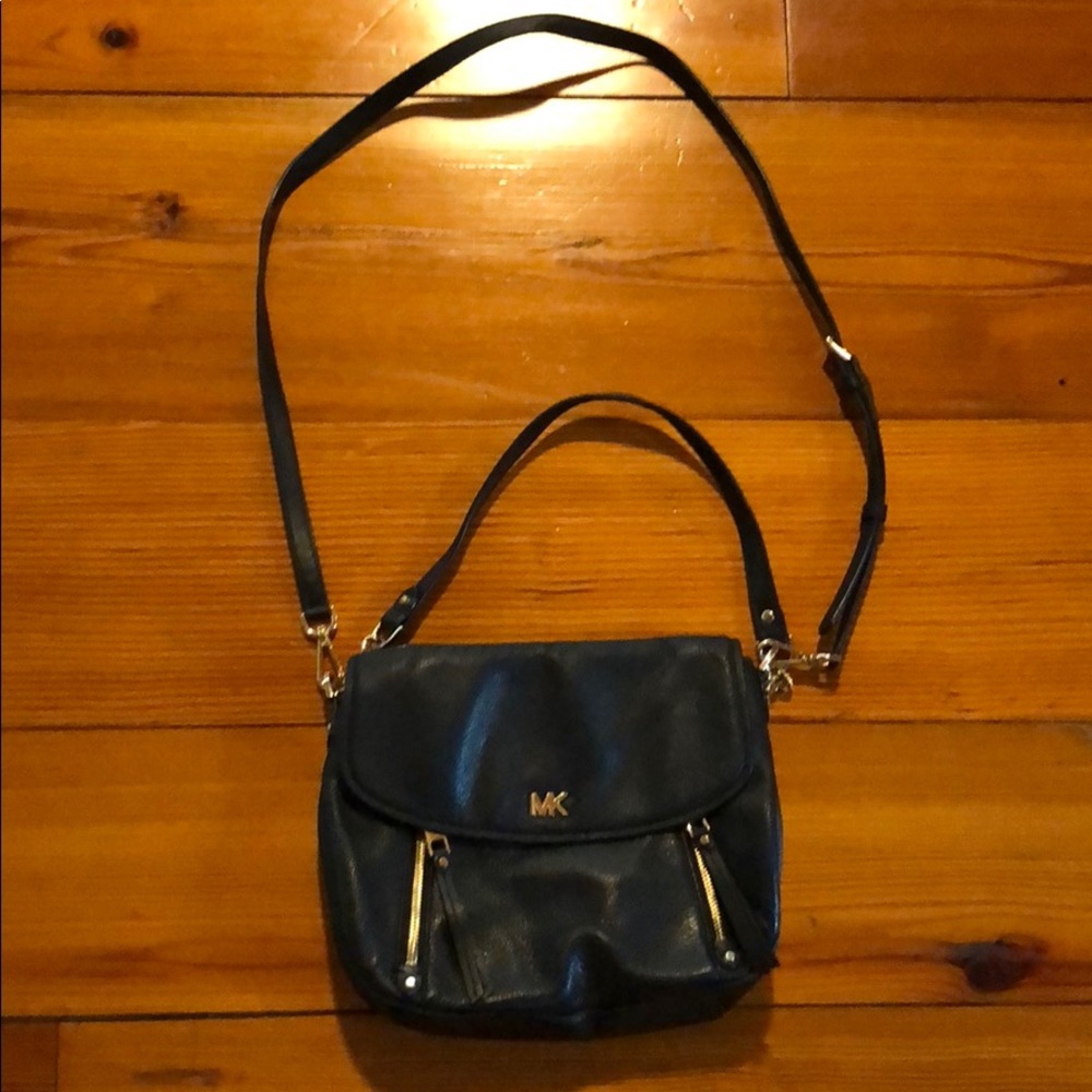 Michael Kors purse black the purse is 10” Wide and 8 “ length